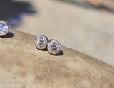 platinum and 14k gold bezel set European cut diamond studs earrings - .21ct tw