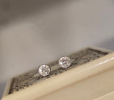 platinum and 14k gold bezel set European cut diamond studs earrings - .21ct tw