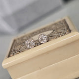 platinum and 14k gold bezel set European cut diamond studs earrings - .28ct tw
