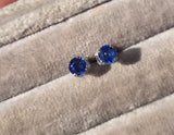 14k white gold blue sapphire scroll stud earrings