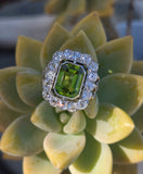 Platinum emerald cut peridot and old cut diamond estate ring