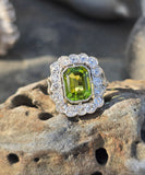 Platinum emerald cut peridot and old cut diamond estate ring
