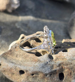 Platinum emerald cut peridot and old cut diamond estate ring