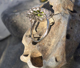 Platinum emerald cut peridot and old cut diamond estate ring