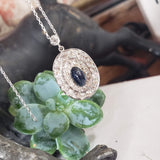 platinum top & gold vintage blue sapphire & old cut diamond halo necklace pendant