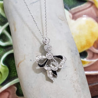 platinum Edwardian black onyx & diamond BOW necklace pendant