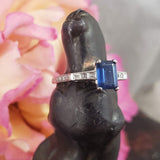 Platinum emerald cut blue sapphire & diamond estate ring