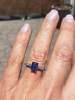 Platinum emerald cut blue sapphire & diamond estate ring