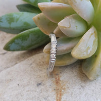 Platinum baguette & round diamond vintage curved band
