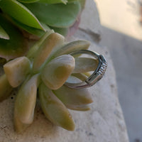 Platinum baguette & round diamond vintage curved band