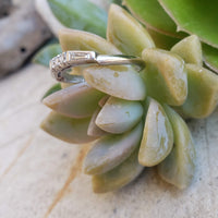 Platinum baguette & round diamond vintage curved band