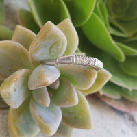 Platinum baguette & round diamond vintage curved band