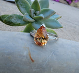 Platinum precious topaz & baguette diamond ring - pear cut