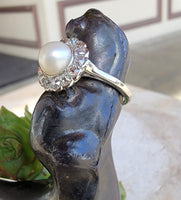 Platinum Edwardian pearl & diamond halo ring