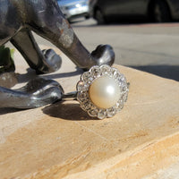 Platinum Edwardian pearl & diamond halo ring