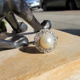 Platinum Edwardian pearl & diamond halo ring