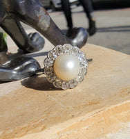 Platinum Edwardian pearl & diamond halo ring