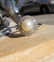 Platinum Edwardian pearl & diamond halo ring