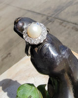 Platinum Edwardian pearl & diamond halo ring