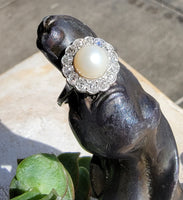 Platinum Edwardian pearl & diamond halo ring