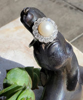 Platinum Edwardian pearl & diamond halo ring