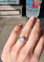 Platinum Edwardian pearl & diamond halo ring