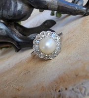 Platinum Edwardian pearl & diamond halo ring