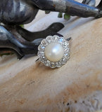 Platinum Edwardian pearl & diamond halo ring