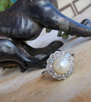 Platinum Edwardian pearl & diamond halo ring