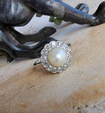 Platinum Edwardian pearl & diamond halo ring