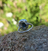 platinum cabochon blue sapphire halo estate ring
