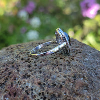 platinum cabochon blue sapphire halo estate ring
