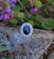 platinum cabochon blue sapphire halo estate ring