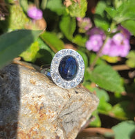 platinum cabochon blue sapphire halo estate ring