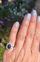 platinum cabochon blue sapphire halo estate ring