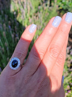 platinum cabochon blue sapphire halo estate ring