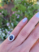 platinum cabochon blue sapphire halo estate ring