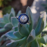 platinum European cut diamond & blue sapphire halo target ring