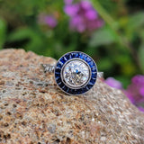 platinum European cut diamond & blue sapphire halo target ring