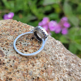 platinum European cut diamond & blue sapphire halo target ring