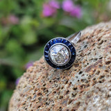 platinum European cut diamond & blue sapphire halo target ring
