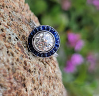 platinum European cut diamond & blue sapphire halo target ring