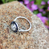 platinum European cut diamond & blue sapphire halo target ring