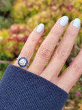 platinum European cut diamond & blue sapphire halo target ring