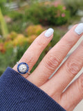 platinum European cut diamond & blue sapphire halo target ring
