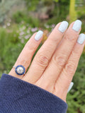 platinum European cut diamond & blue sapphire halo target ring