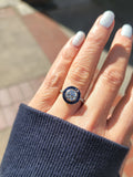 platinum European cut diamond & blue sapphire halo target ring