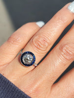 platinum European cut diamond & blue sapphire halo target ring