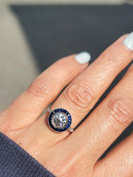 platinum European cut diamond & blue sapphire halo target ring