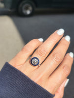 platinum European cut diamond & blue sapphire halo target ring